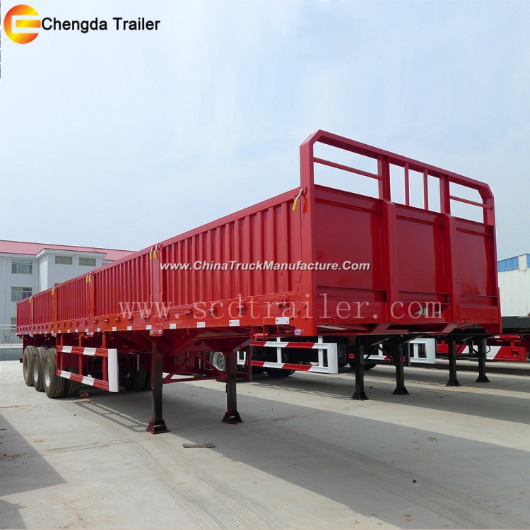 Side Gate and Fence Truck Driving Large Cargo Trailer